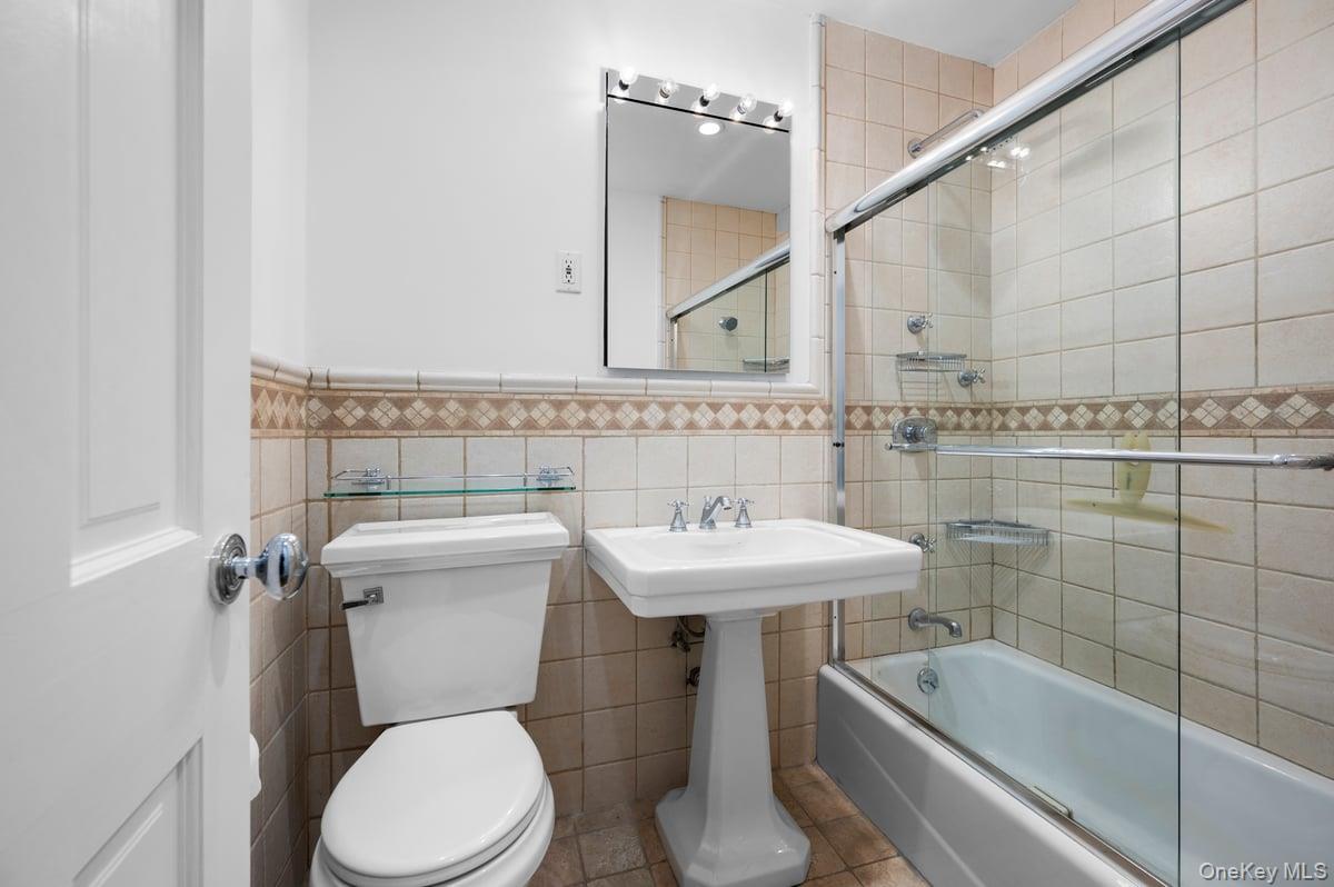 600 Locust Street, Unit 2J Mount Vernon, NY 10552 - Photo 5 of 18 a bathroom with a sink a toilet and shower