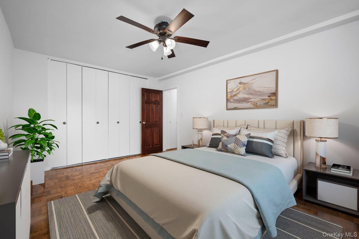 600 Locust Street, Unit 2J Mount Vernon, NY 10552 - Photo 10 of 18 a bedroom with bed and a chandelier