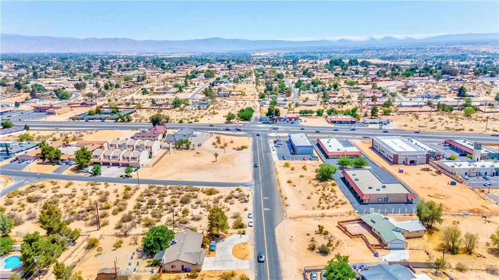 15860 Tao Road Apple Valley, CA 92307 - Photo 1 of 1 an aerial view of residential houses with outdoor space
