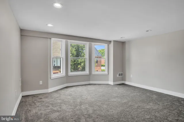 an empty room with windows