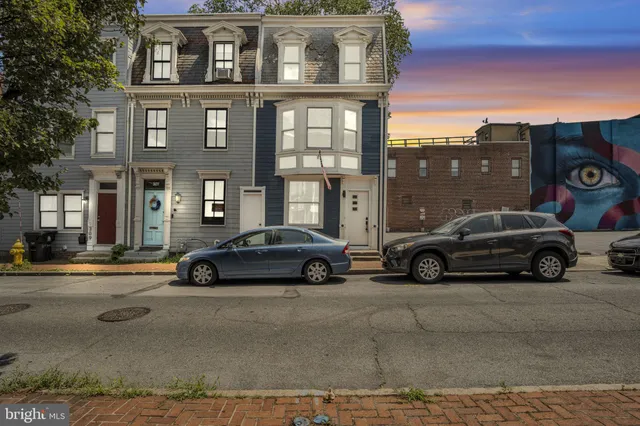 a view of a car parked in front of a building