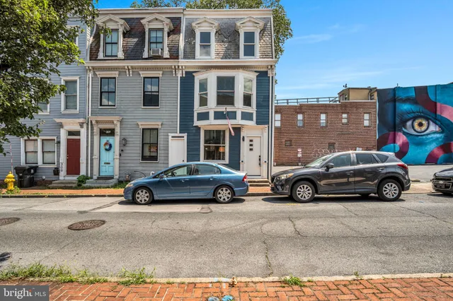 a view of a cars parked in front of a building