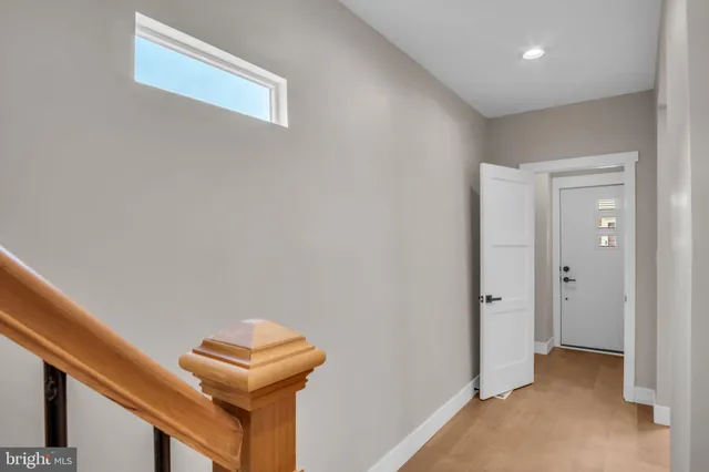 a view of a hallway with staircase