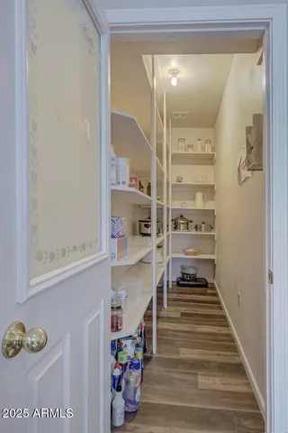 a view of an entryway with wooden floor