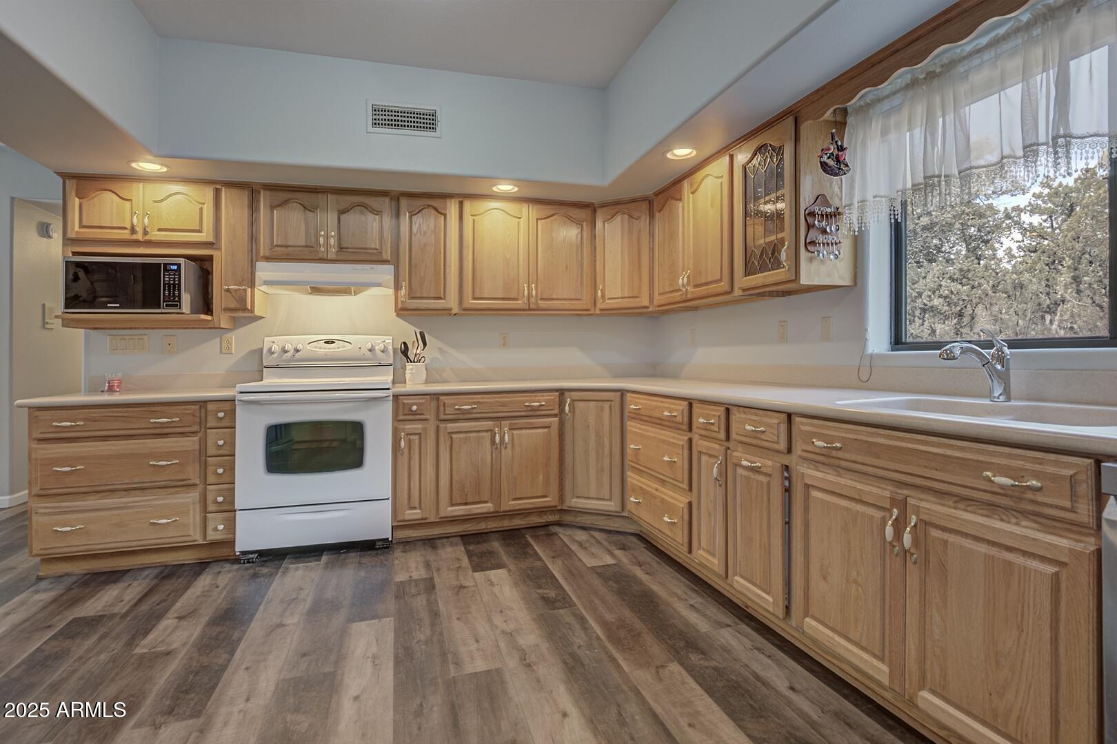 5776 West Sundance Circle Pine, AZ 85544 - Photo 12 of 35 a kitchen with sink cabinets and window