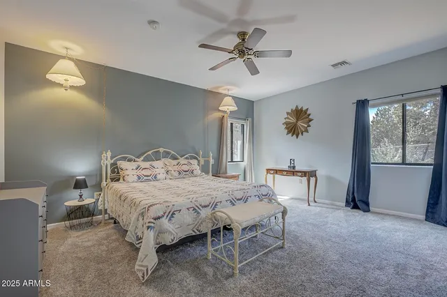 a bedroom with a bed and a table