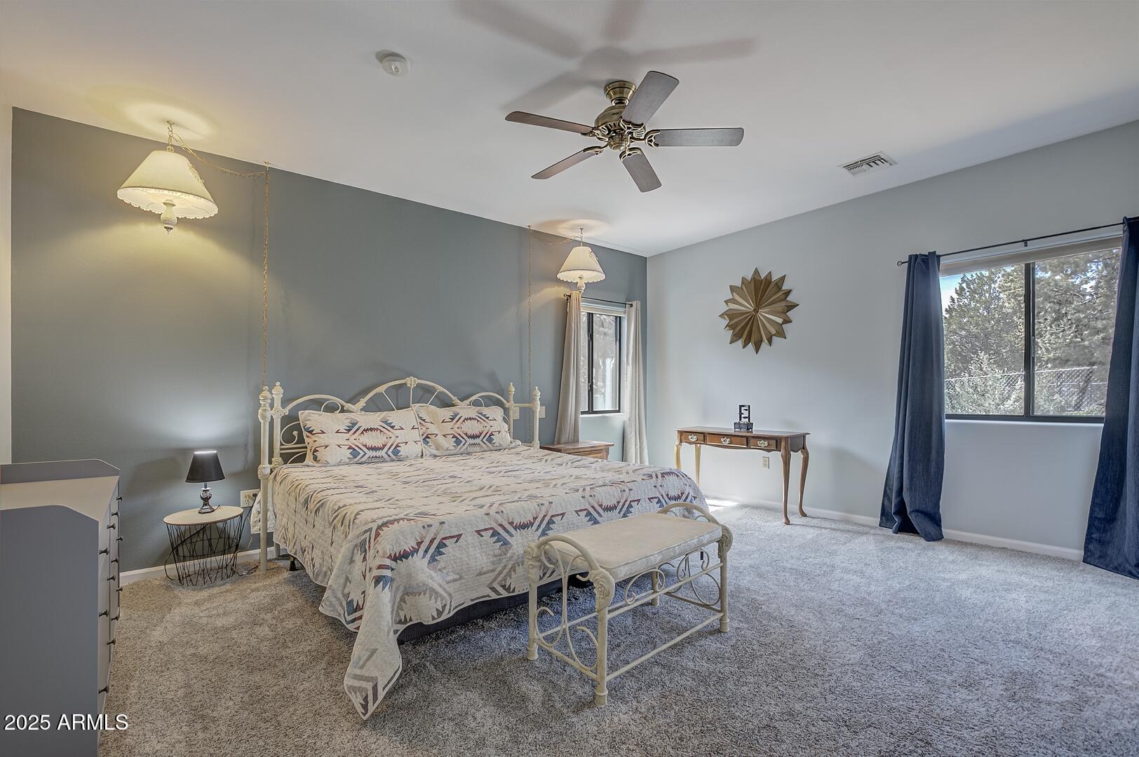 5776 West Sundance Circle Pine, AZ 85544 - Photo 15 of 35 a bedroom with a bed and a table