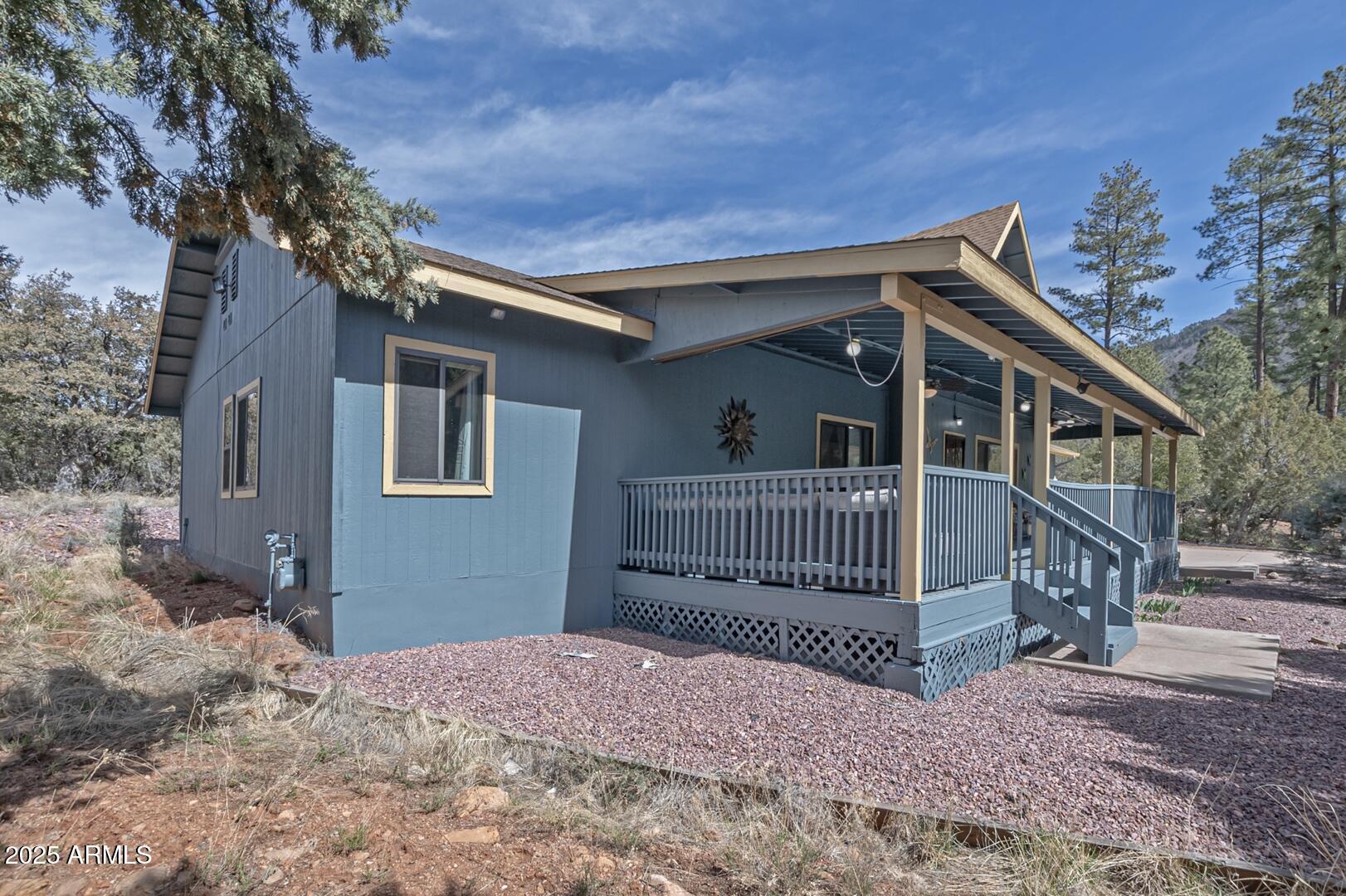 5776 West Sundance Circle Pine, AZ 85544 - Photo 32 of 35 a view of a house with a yard and wooden fence