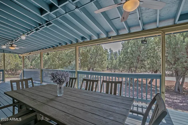 a view of a balcony with wooden floor