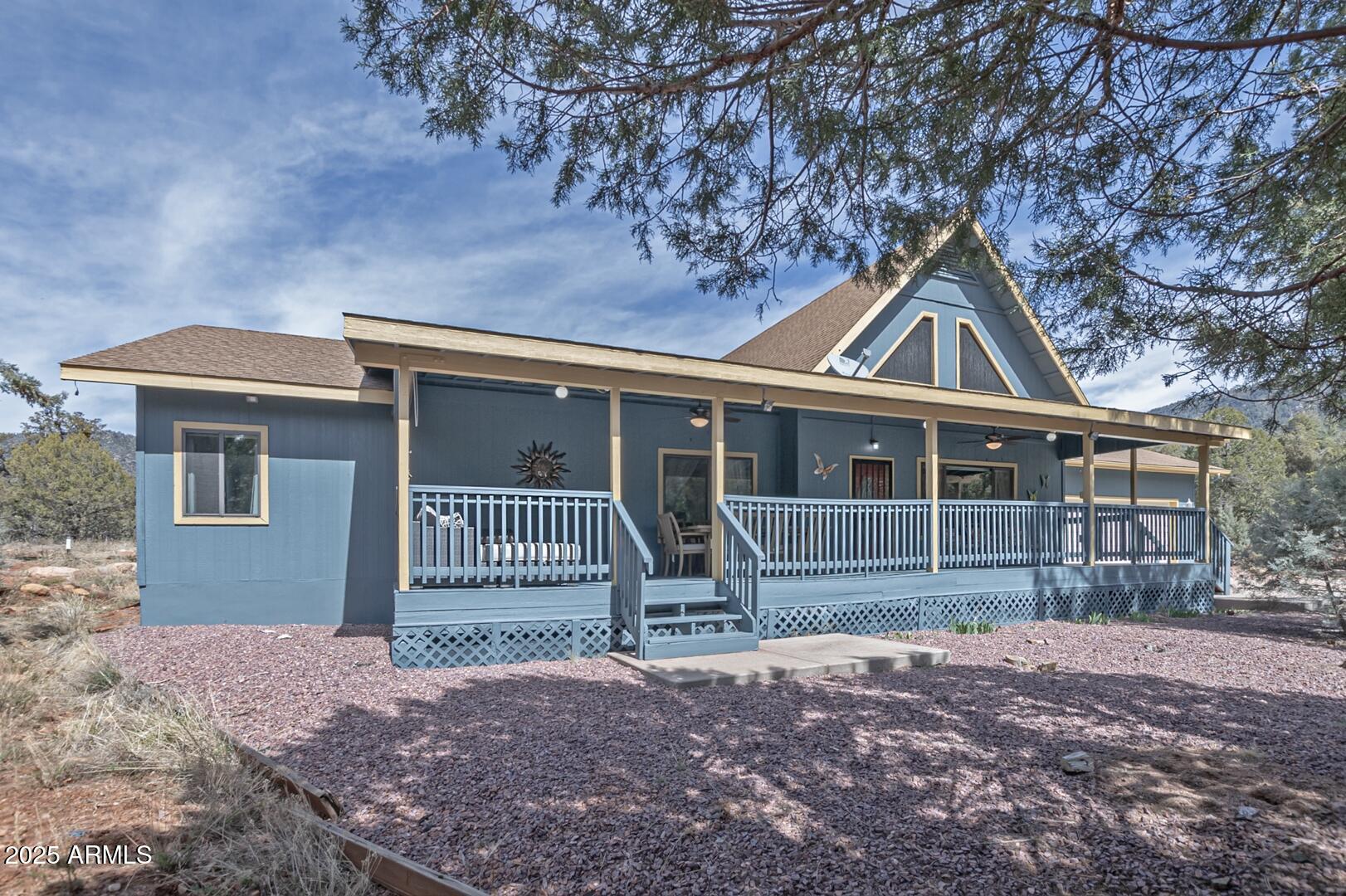 5776 West Sundance Circle Pine, AZ 85544 - Photo 35 of 35 a front view of a house with a garden