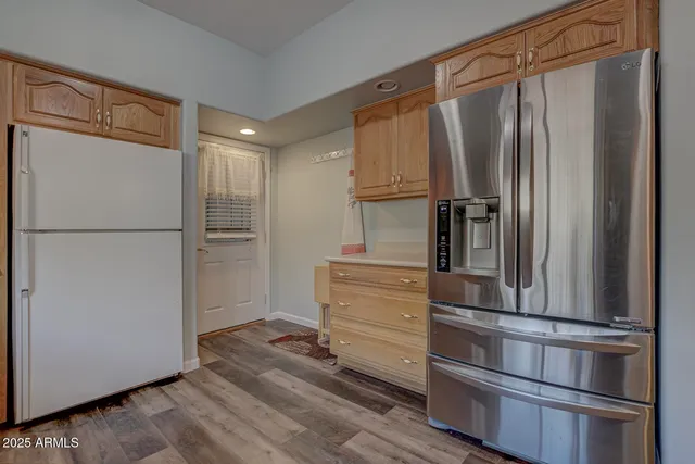 a kitchen with appliances and cabinets