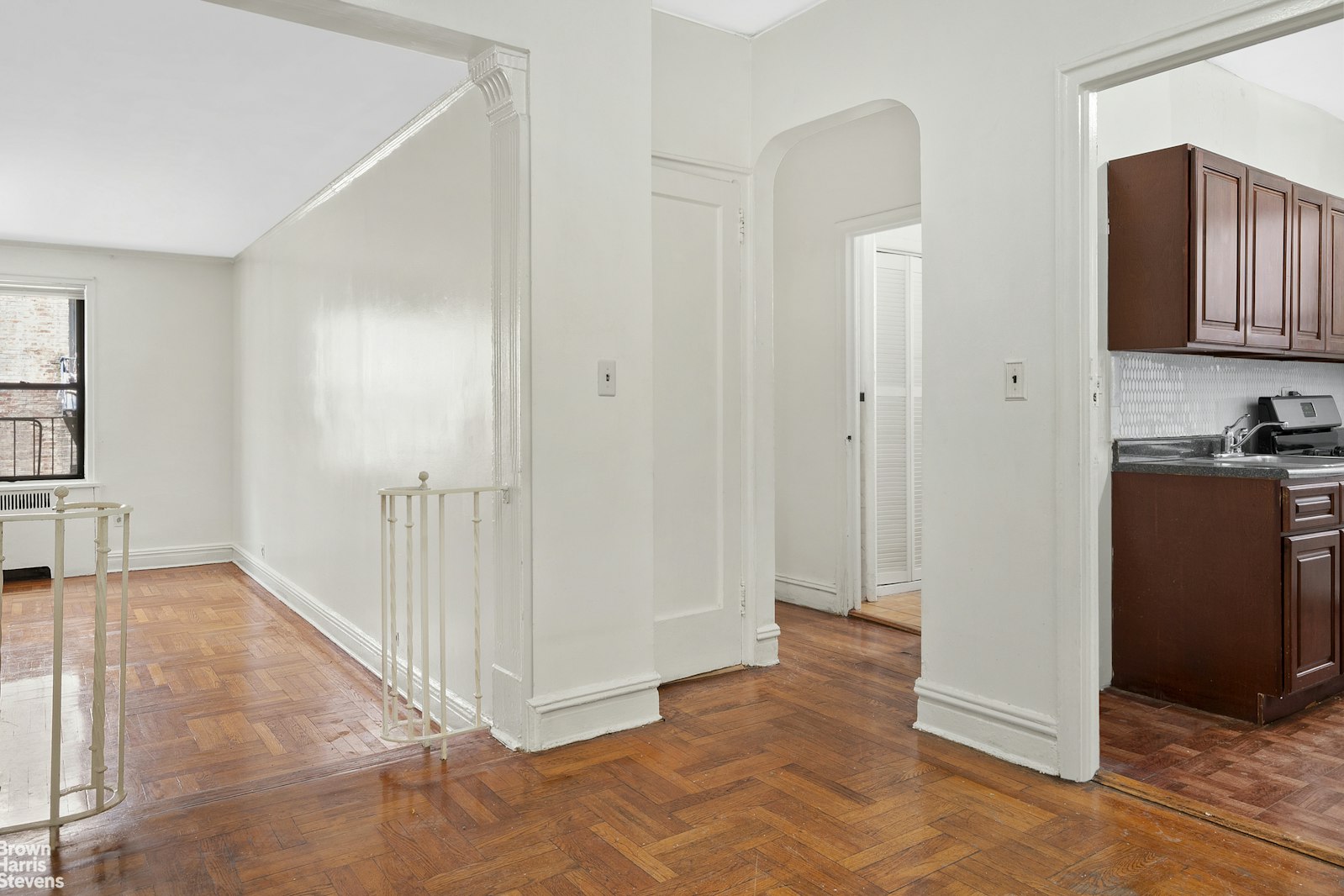 a view of a hallway view with wooden floor and staircase