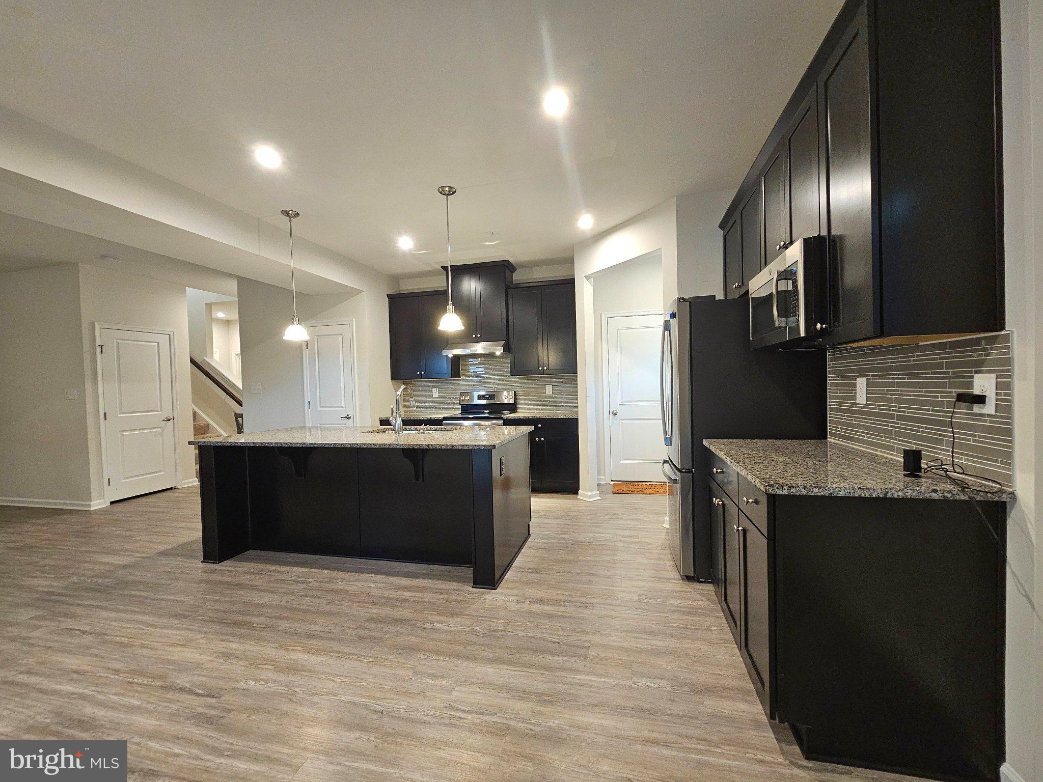 9367 Mulligan Way Delmar, MD 21875 - Photo 13 of 38 Modern kitchen with sleek finishes.