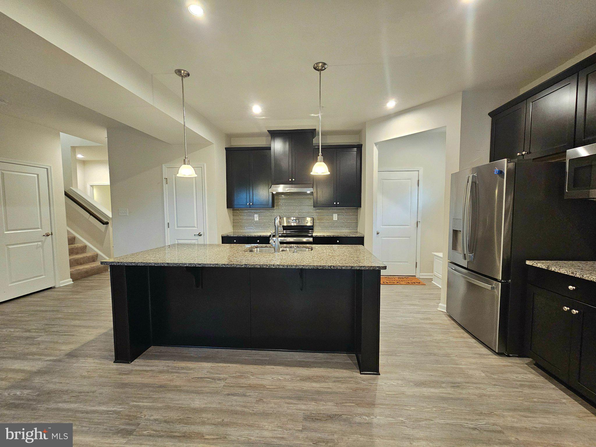 9367 Mulligan Way Delmar, MD 21875 - Photo 14 of 38 Modern kitchen with sleek finishes.