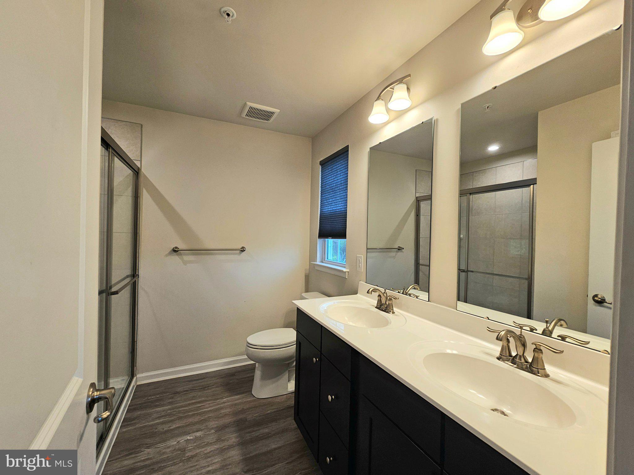 9367 Mulligan Way Delmar, MD 21875 - Photo 21 of 38 Modern dual-sink bathroom oasis.