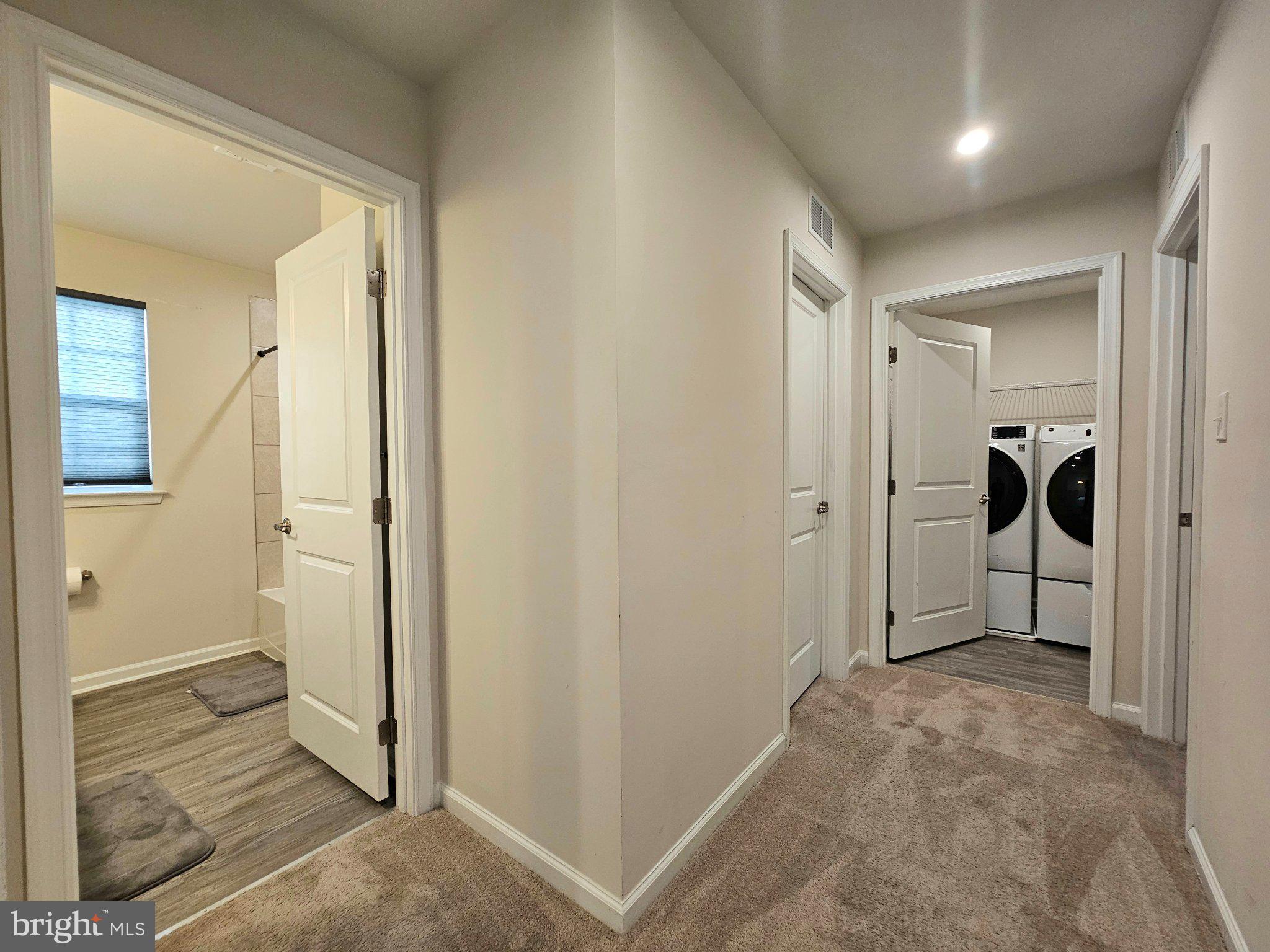 9367 Mulligan Way Delmar, MD 21875 - Photo 24 of 38 Modern hallway with laundry access.