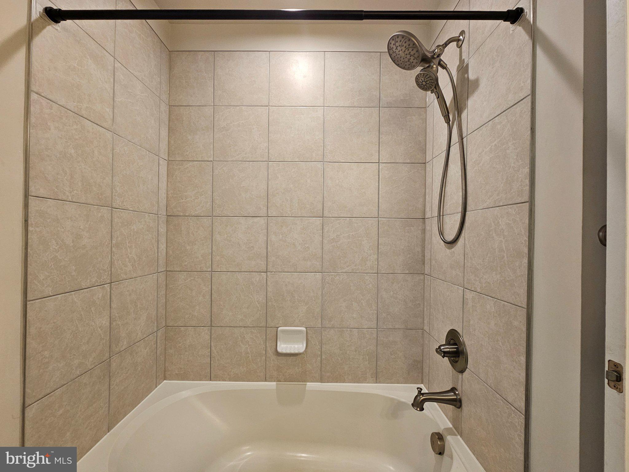 9367 Mulligan Way Delmar, MD 21875 - Photo 26 of 38 Modern shower with elegant tiles.