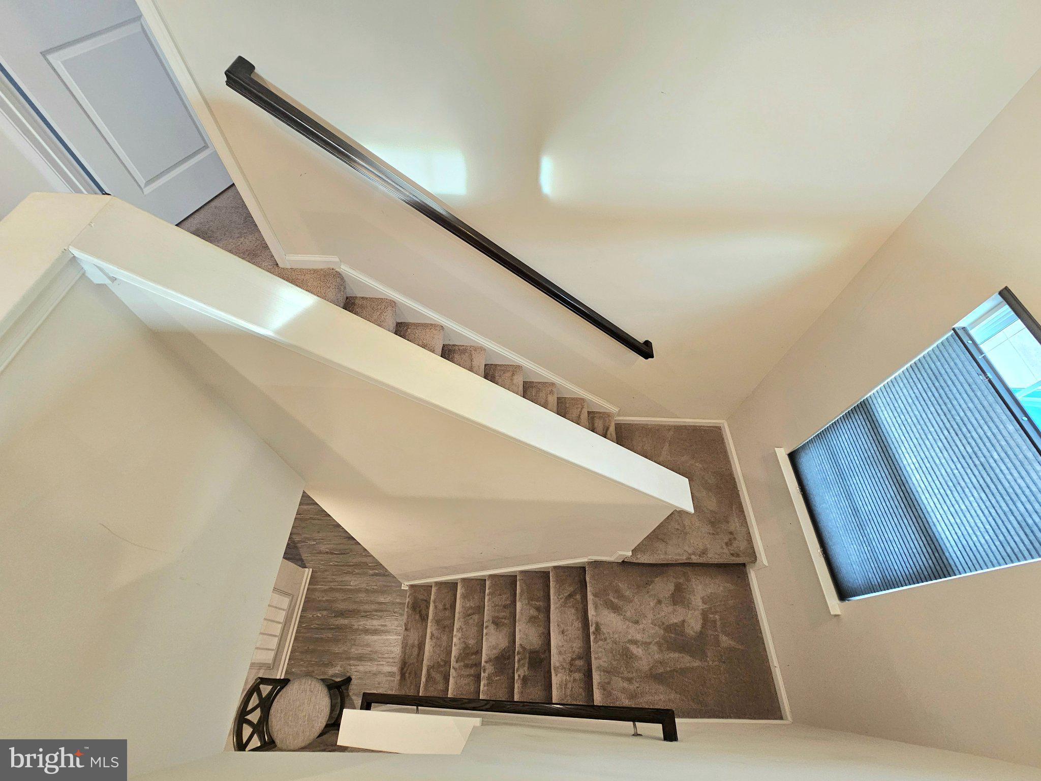 9367 Mulligan Way Delmar, MD 21875 - Photo 32 of 38 Elegant staircase with natural light.