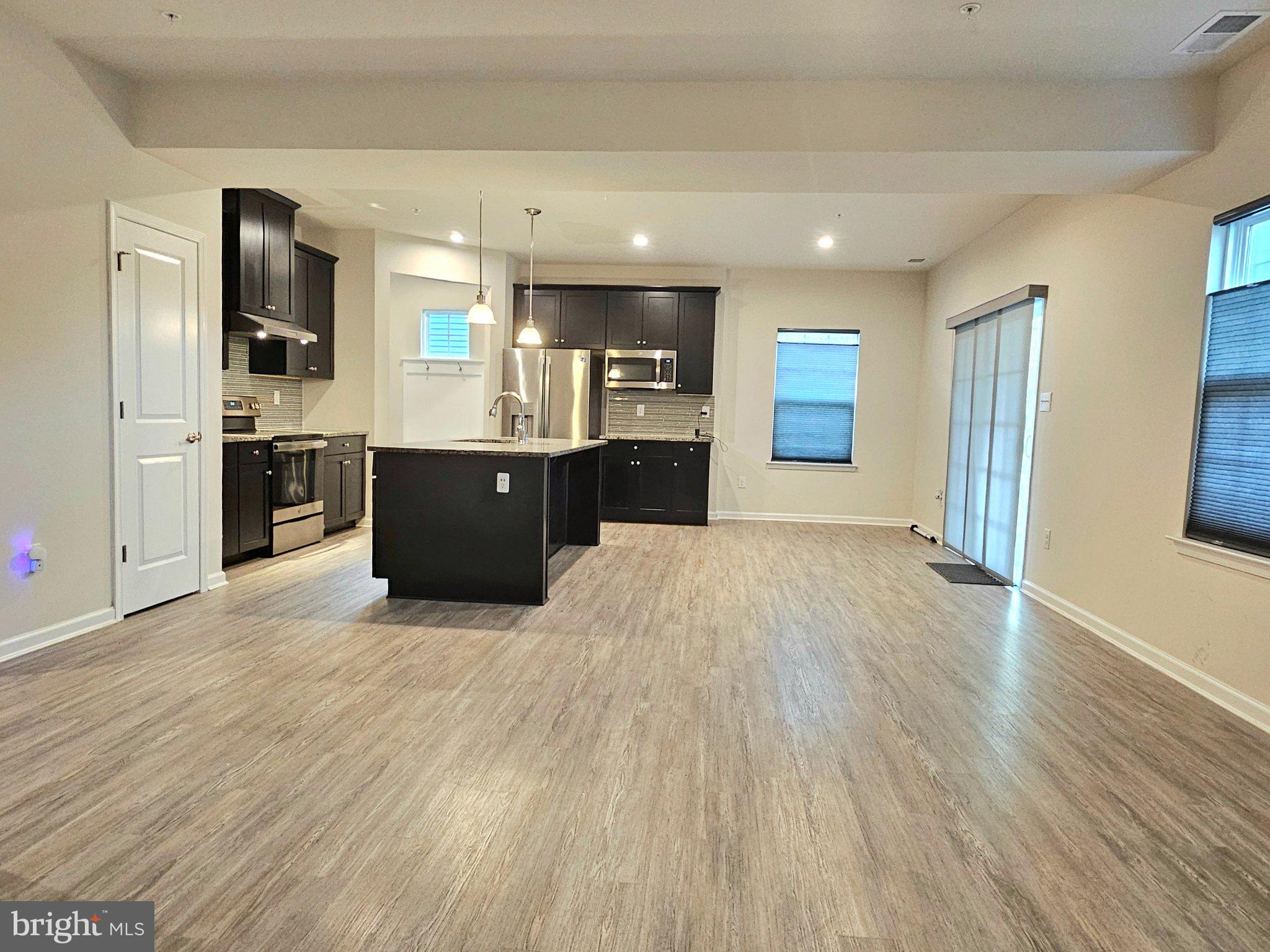 9367 Mulligan Way Delmar, MD 21875 - Photo 7 of 38 Modern open-concept living space.