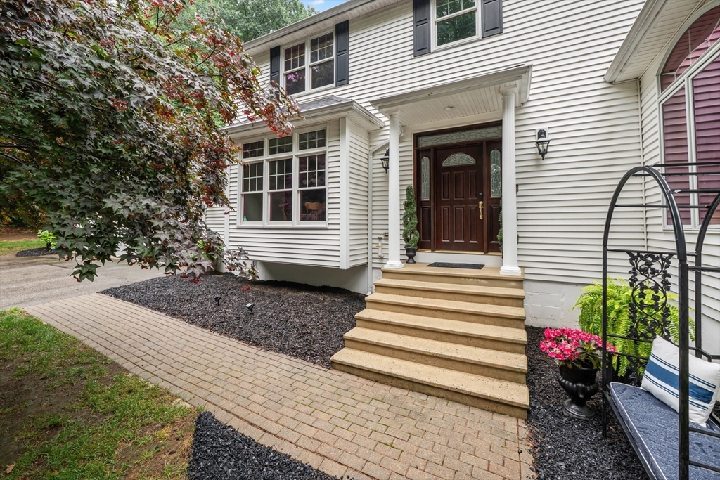 14 Demond Pond Row Rutland, MA 01543 - Photo 6 of 42 a view of a house with a yard and a garden