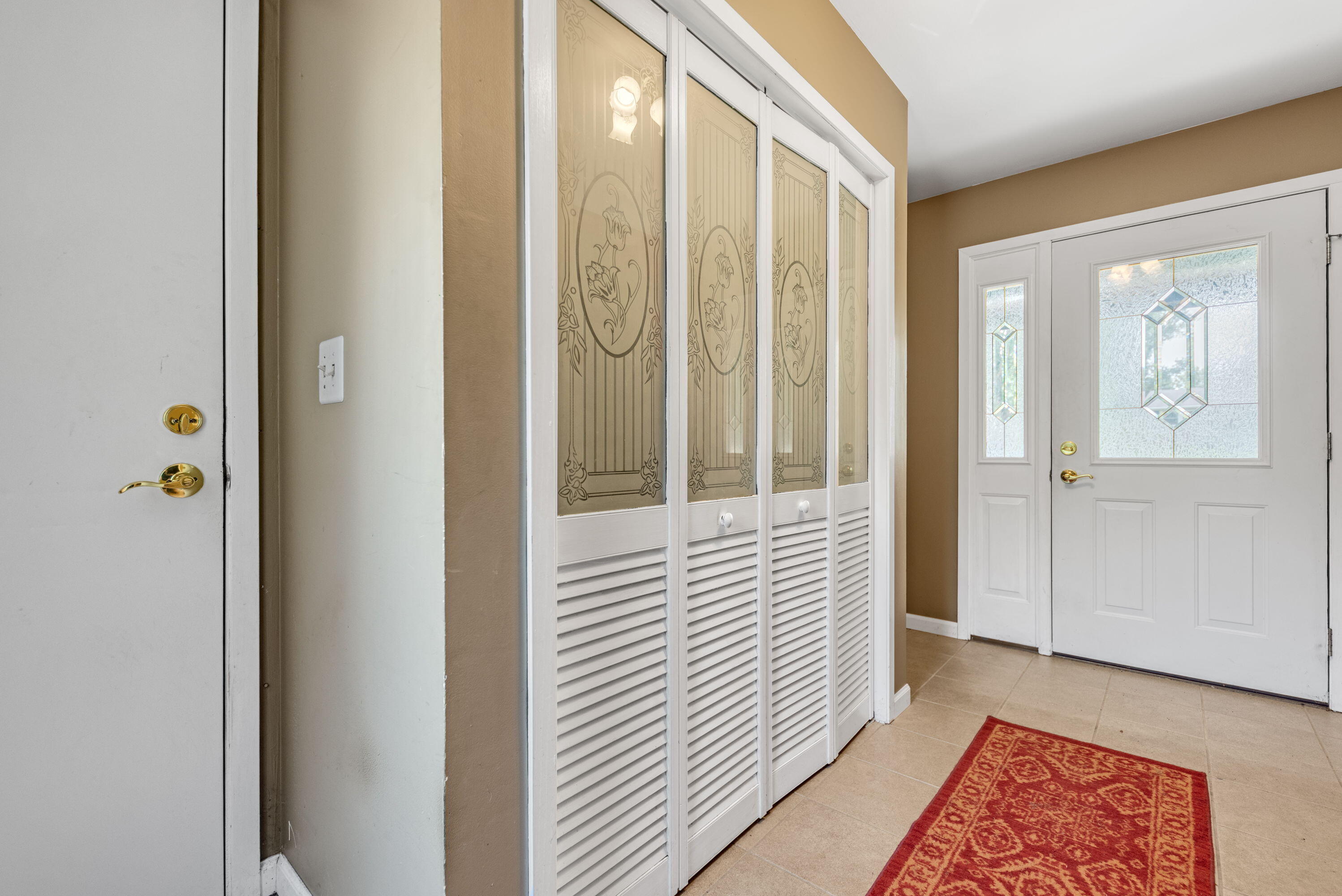 2337 Four Seasons Parkway Crown Point, IN 46307 - Photo 2 of 18 a view of a hallway with wooden floor and closet