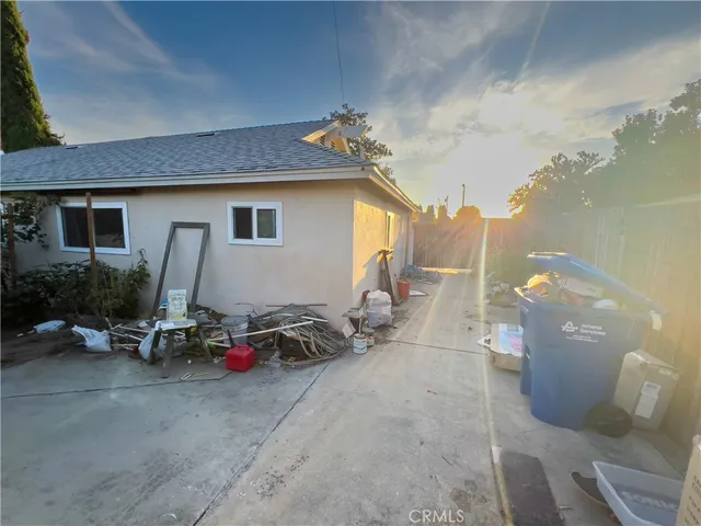 a view of a patio with table and chairs a barbeque