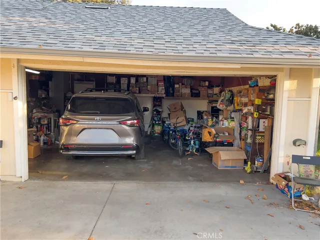 a view of parking garage with cars