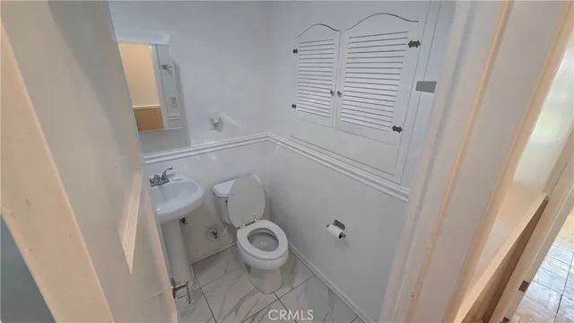 a bathroom with a sink and toilet