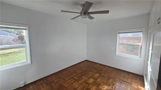 a view of empty room with windows