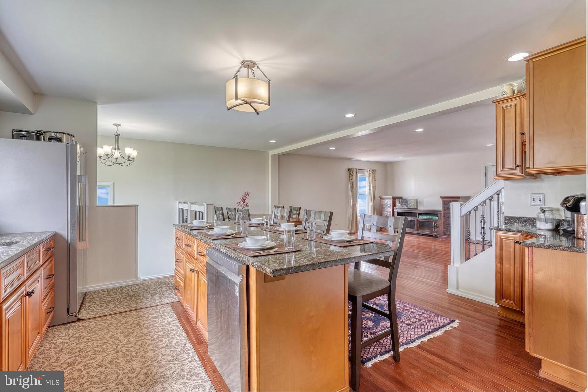 12534 Mt Olivet Road Felton, PA 17322 - Photo 15 of 75 a view of a dining room with furniture a rug and wooden floor