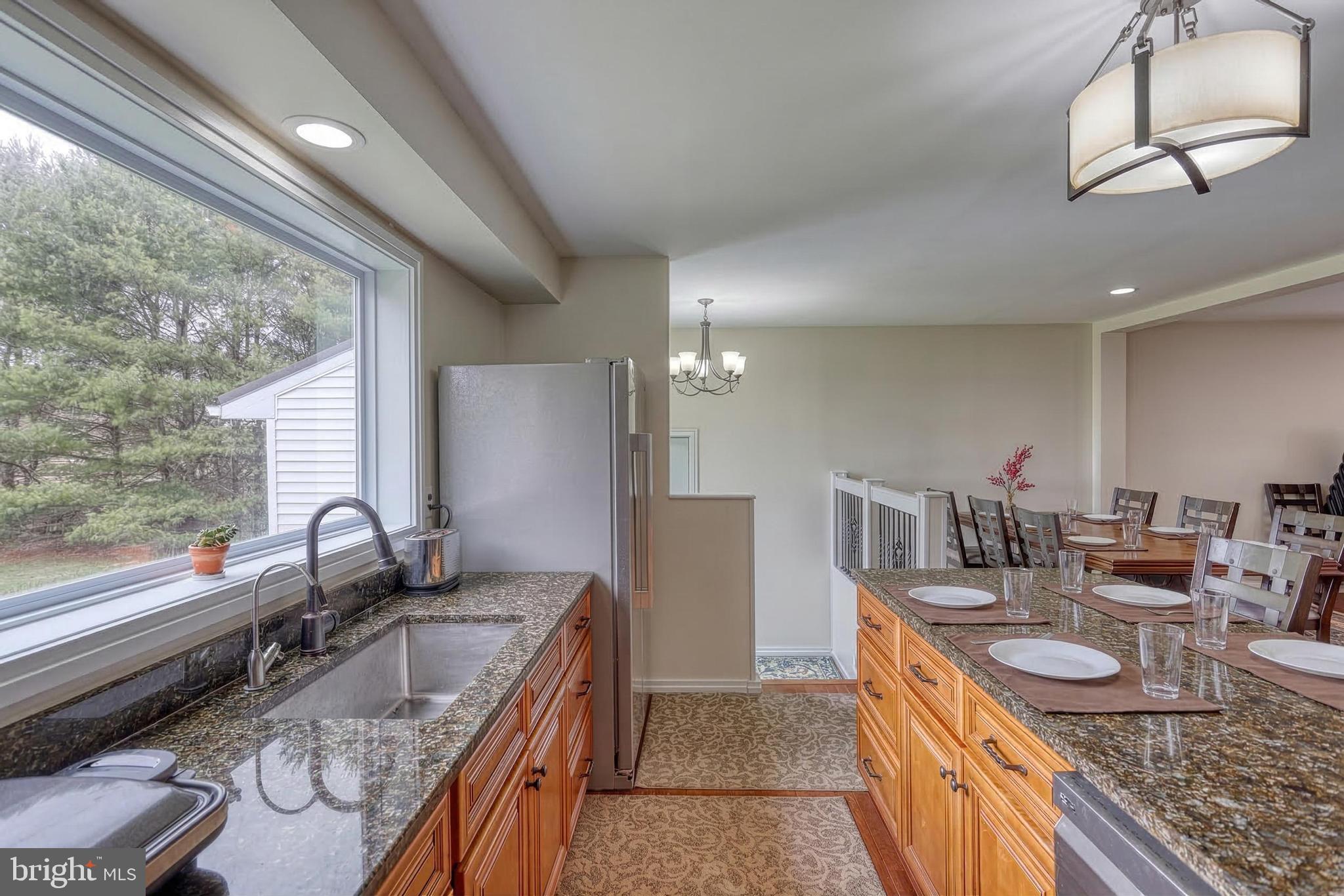 12534 Mt Olivet Road Felton, PA 17322 - Photo 19 of 75 a kitchen with granite countertop a sink and a stove