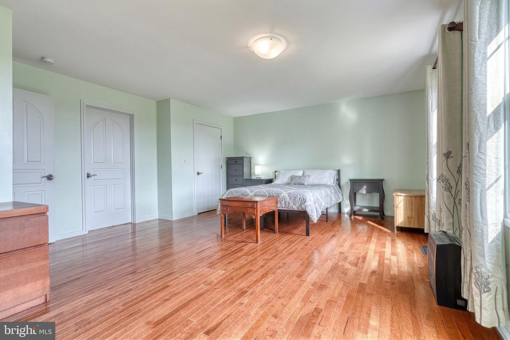 12534 Mt Olivet Road Felton, PA 17322 - Photo 32 of 75 a living room with furniture and a wooden floor