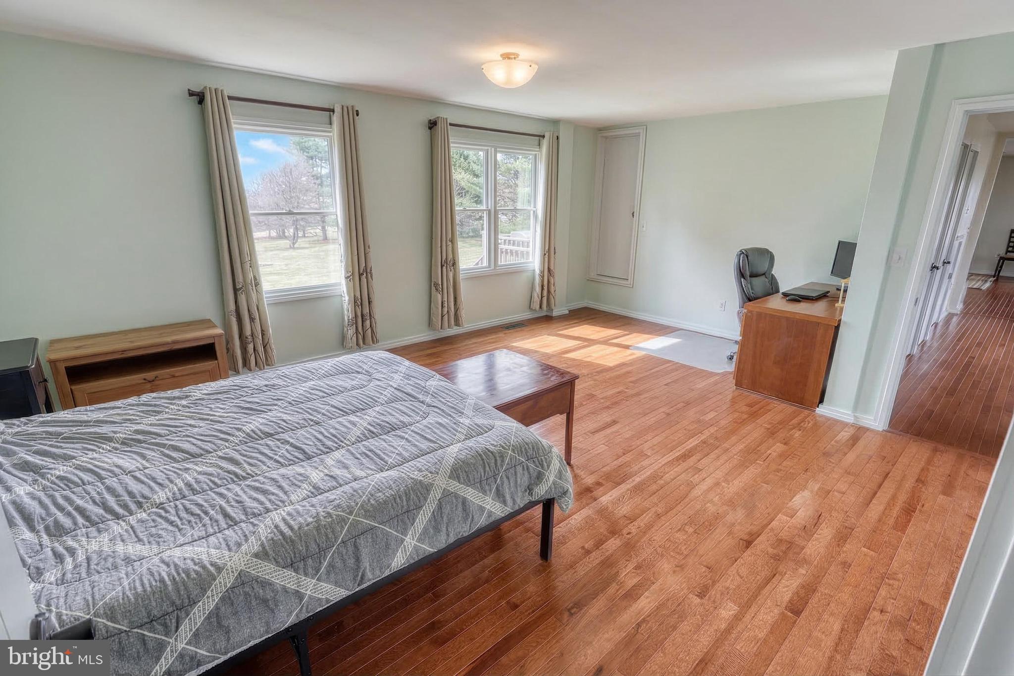 12534 Mt Olivet Road Felton, PA 17322 - Photo 33 of 75 a bedroom with a bed and wooden floor