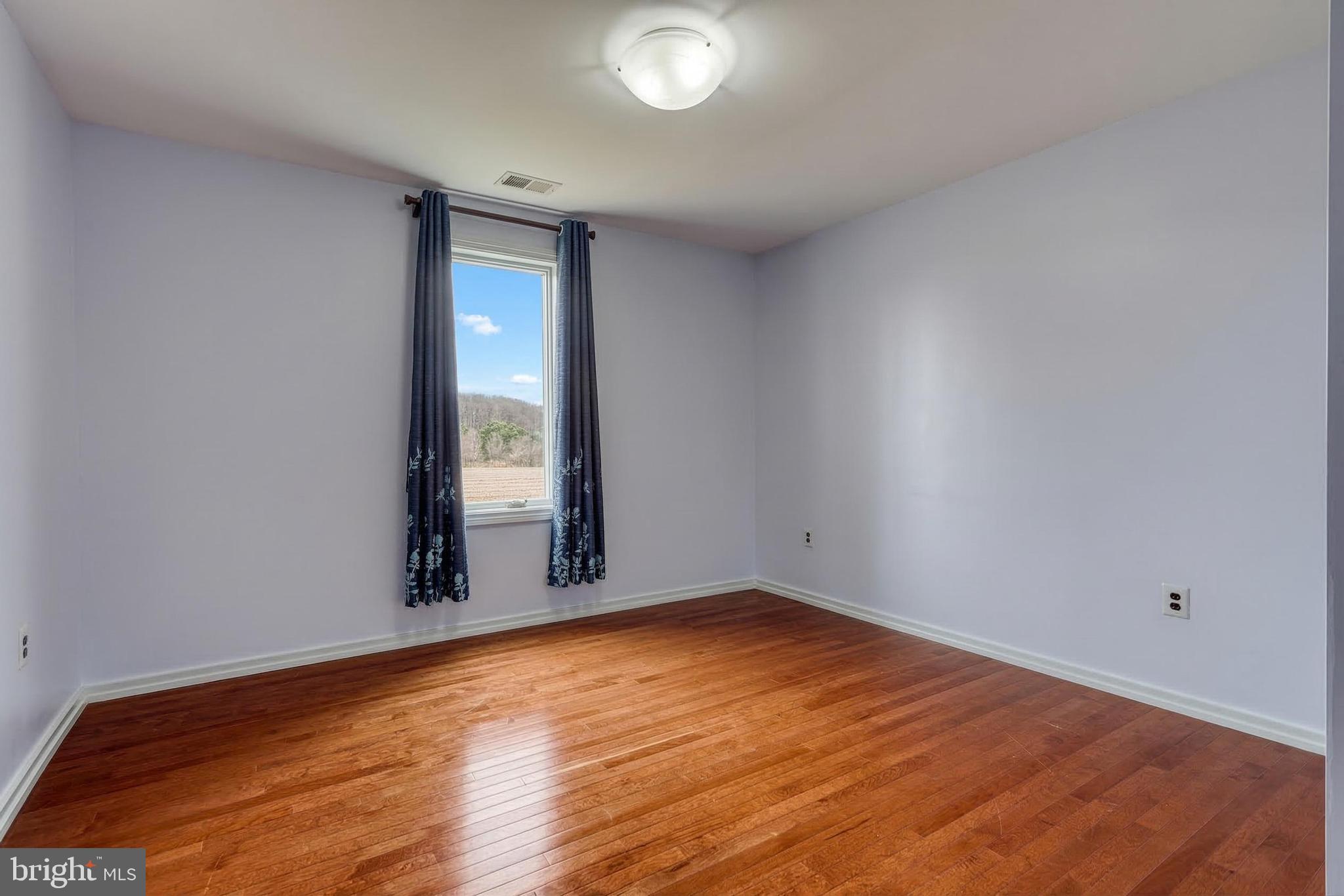 12534 Mt Olivet Road Felton, PA 17322 - Photo 40 of 75 a view of an empty room with wooden floor and a window