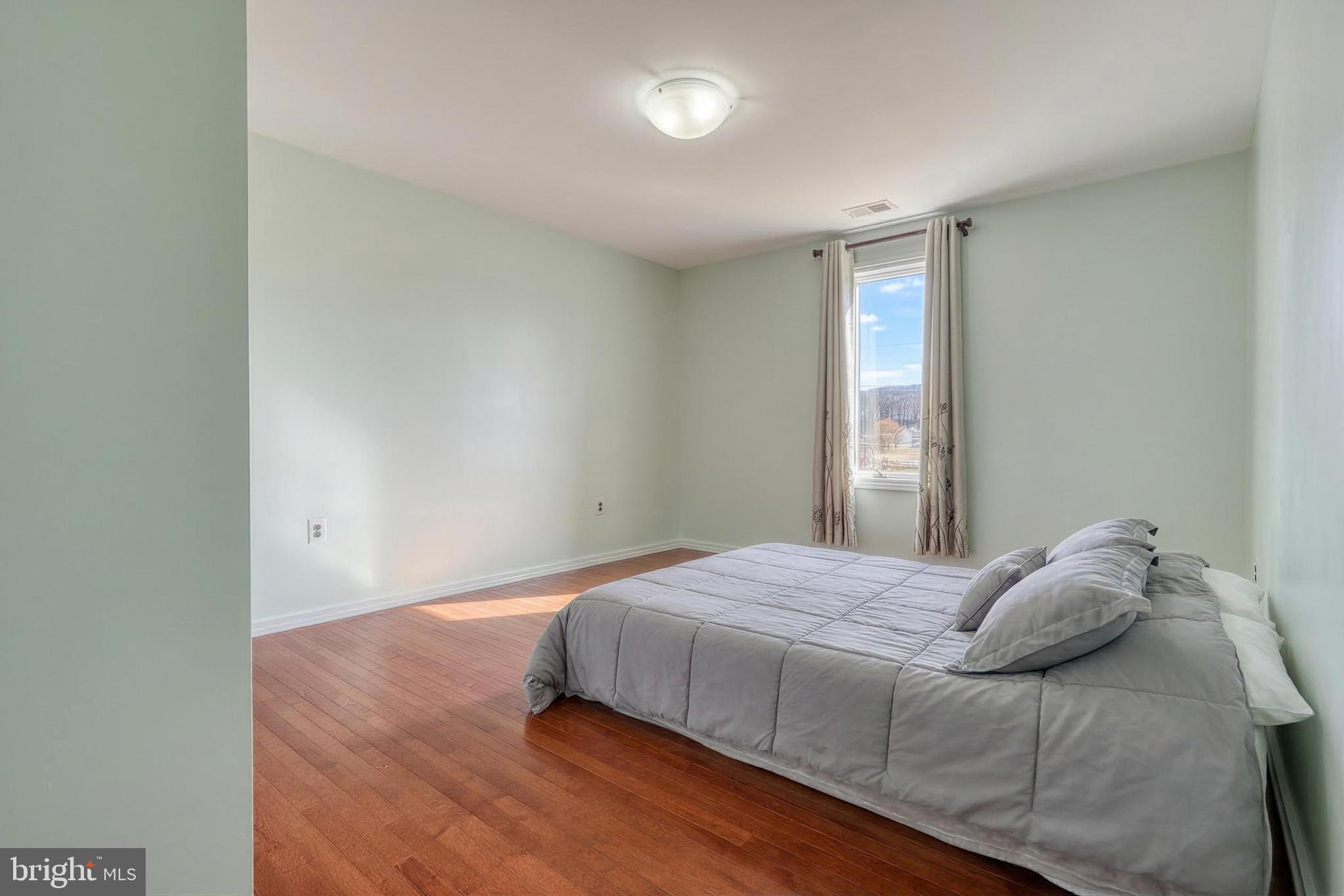 12534 Mt Olivet Road Felton, PA 17322 - Photo 43 of 75 a bedroom with a bed and a window