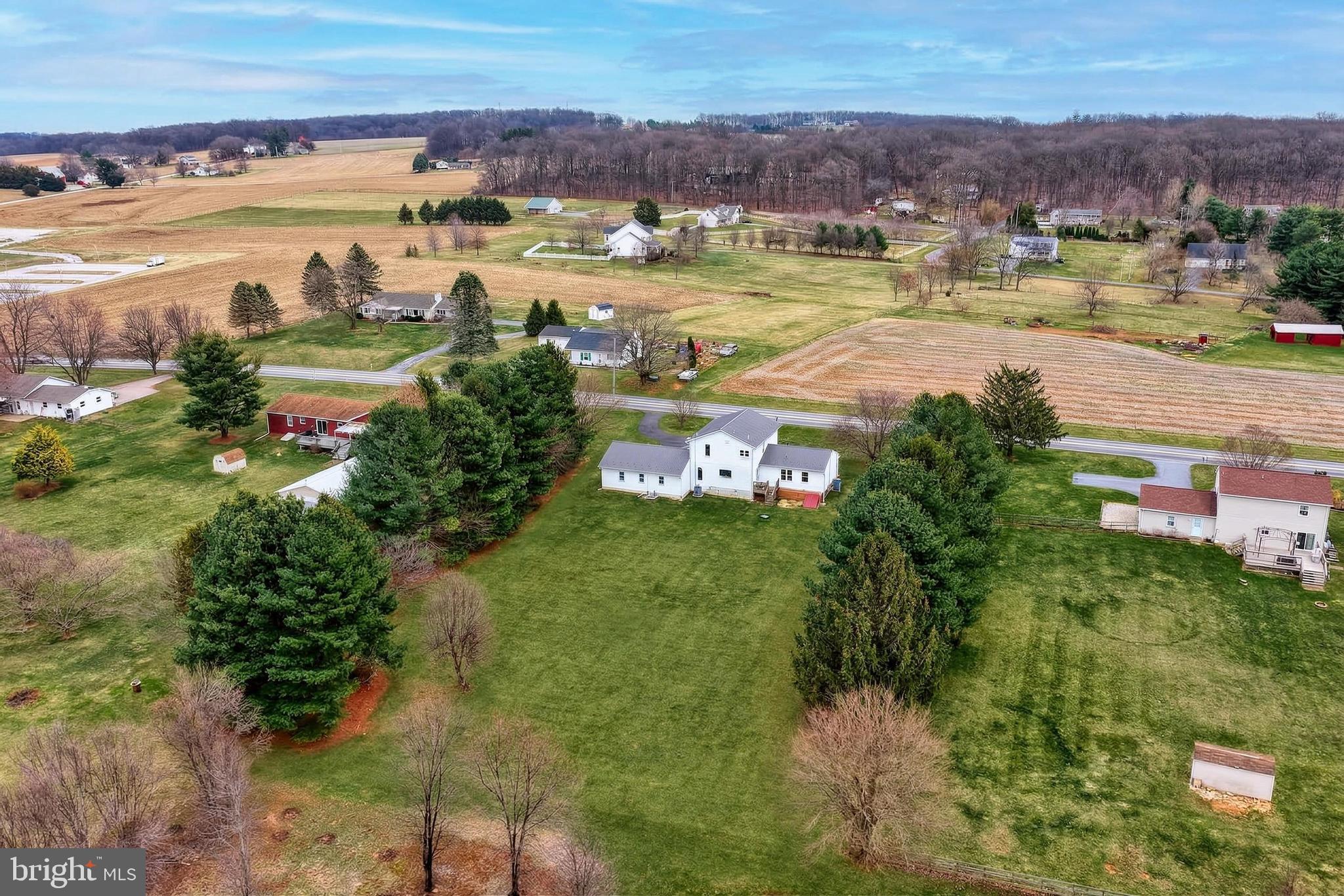 12534 Mt Olivet Road Felton, PA 17322 - Photo 64 of 75 an aerial view of residential houses with outdoor space and river