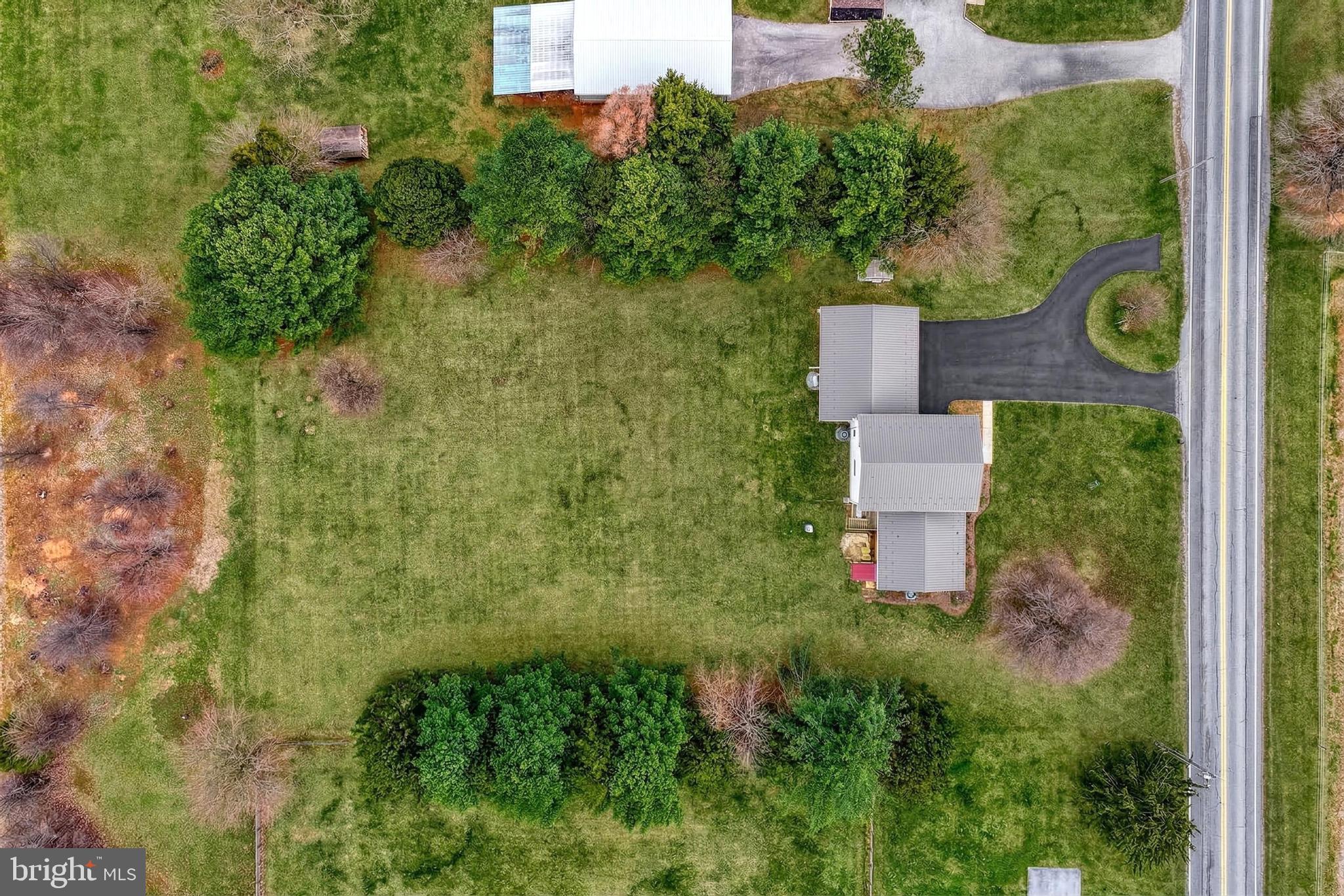 12534 Mt Olivet Road Felton, PA 17322 - Photo 66 of 75 an aerial view of residential house with outdoor space and trees all around