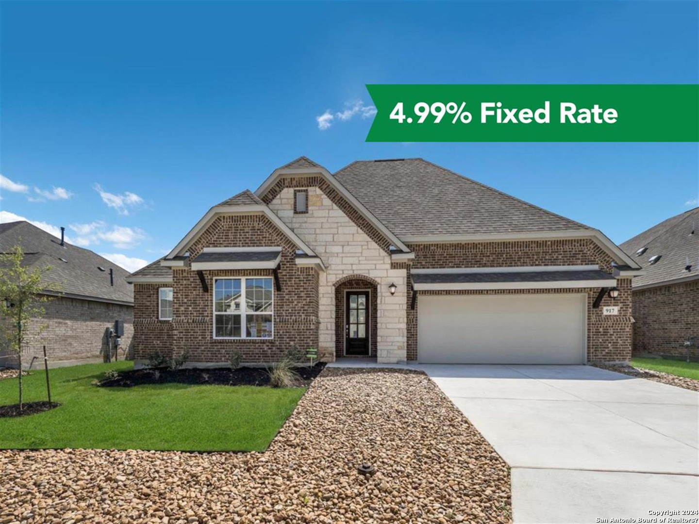 a view of a house with a yard and garage