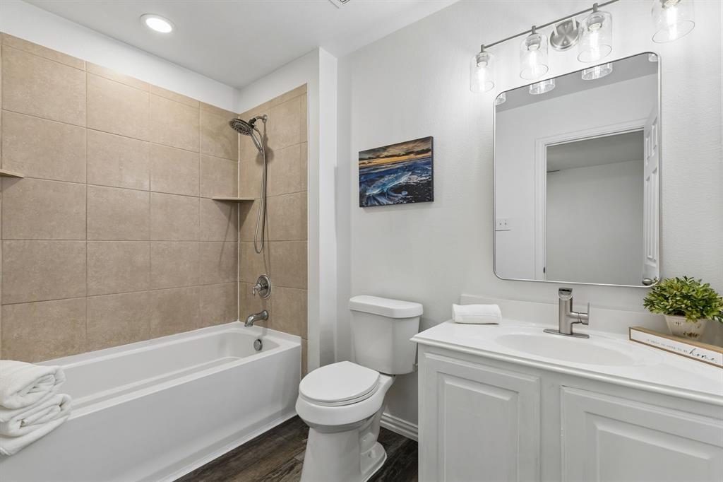 2916 Durango Place Bedford, TX 76021 - Photo 17 of 30 New toilet, new flooring, new light fixture, new mirror, steamed tile and fresh caulk, ready for your toothbrush!