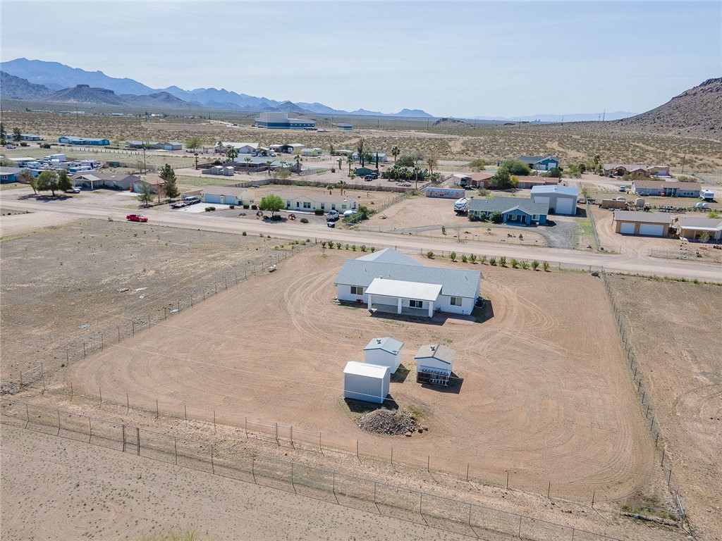 3411 West Carmichael Road Golden Valley, AZ 86413 - Photo 93 of 97 Aerial view of sparsely populated area featuring nearby suburban area and a mountain backdrop