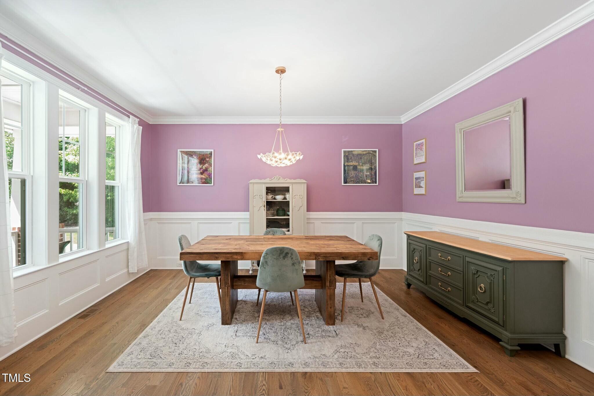 11808 Venture Oak Way Raleigh, NC 27613 - Photo 14 of 42 a view of a dining room with furniture window and wooden floor