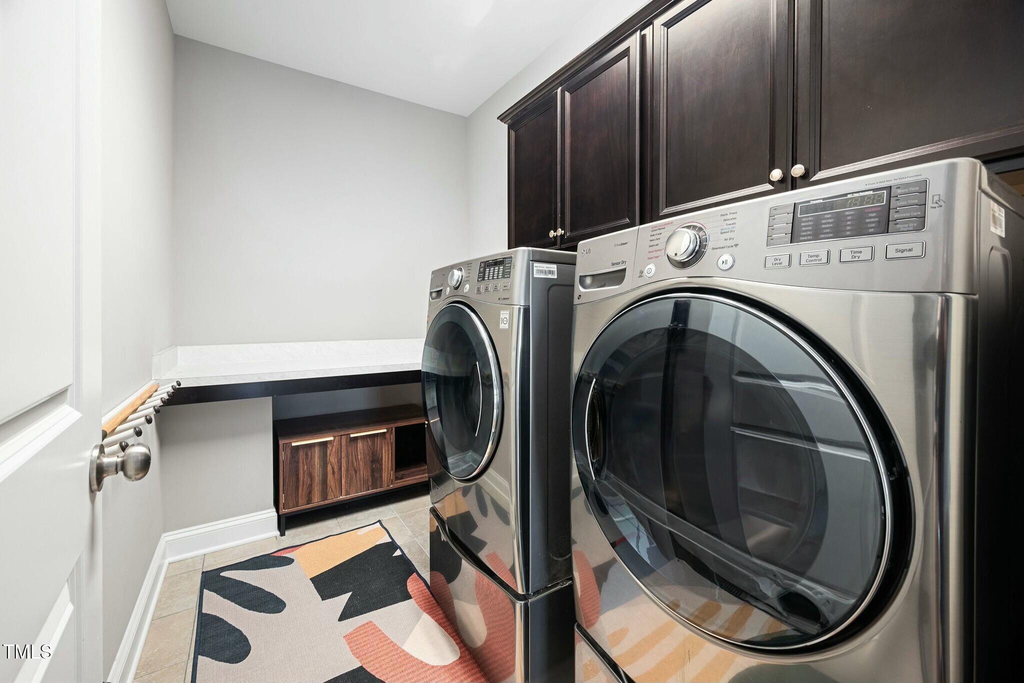 11808 Venture Oak Way Raleigh, NC 27613 - Photo 19 of 42 a utility room with dryer and washer