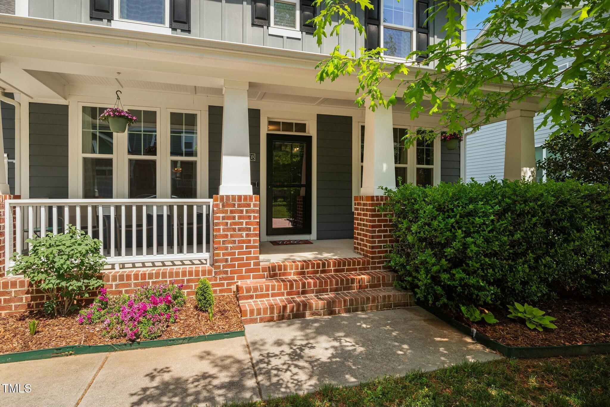 11808 Venture Oak Way Raleigh, NC 27613 - Photo 3 of 42 front view of a brick house with a large window