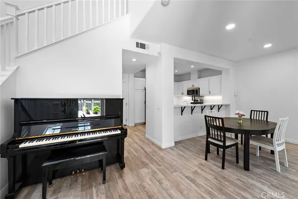 a kitchen with a table and chairs