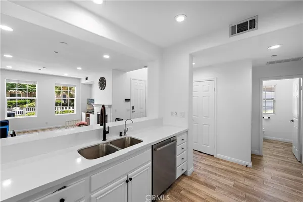 a kitchen with a sink and cabinets