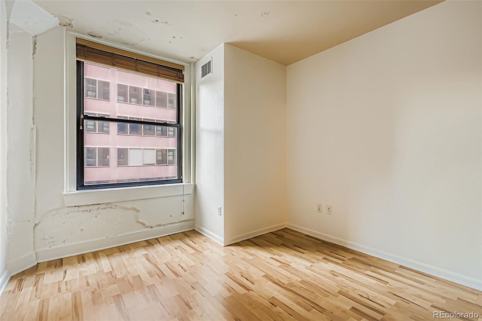 444 17th Street, Unit 404 Denver, CO 80202 - Photo 13 of 37 a view of empty room with wooden floor and fan