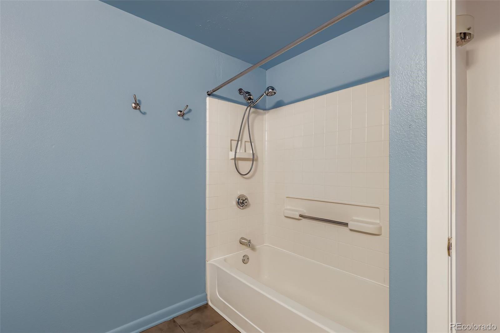 444 17th Street, Unit 404 Denver, CO 80202 - Photo 14 of 37 a bathroom with a bathtub and a shower