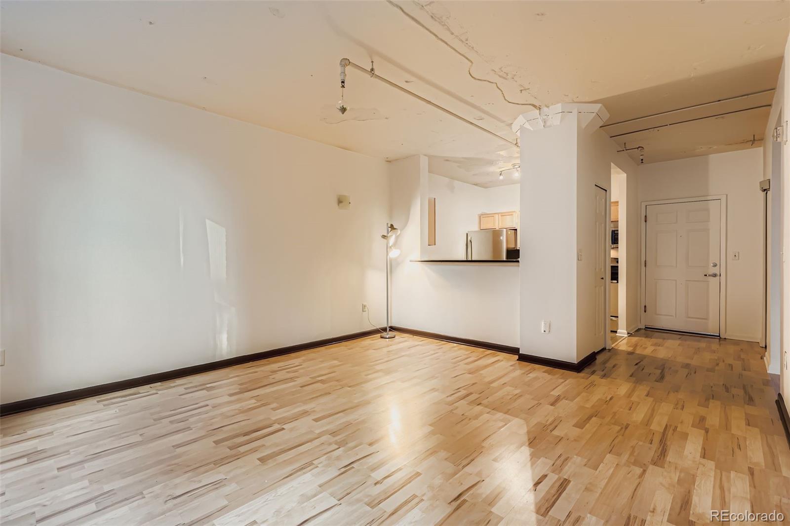 444 17th Street, Unit 404 Denver, CO 80202 - Photo 20 of 37 a view of a room with wooden floor and white walls