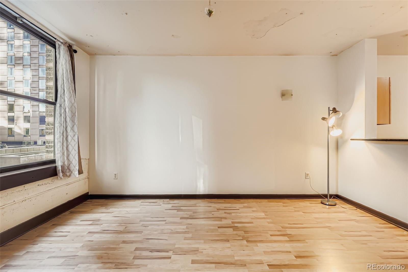 444 17th Street, Unit 404 Denver, CO 80202 - Photo 2 of 37 a view of an empty room with a window