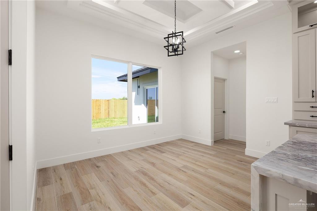 2525 Trinity Avenue McAllen, TX 78504 - Photo 11 of 33 a view of empty room with window and wooden floor